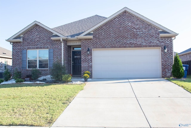 view of front facade with a front yard and a garage