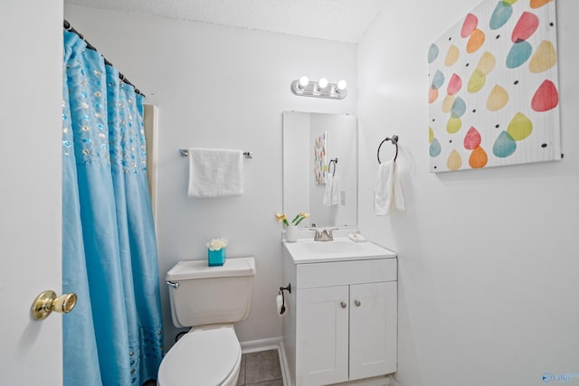 bathroom featuring baseboards, toilet, tile patterned floors, a textured ceiling, and vanity