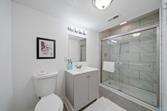 full bath featuring visible vents, toilet, a shower stall, and vanity