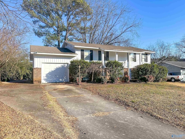 view of front facade featuring an attached garage, board and batten siding, concrete driveway, and brick siding