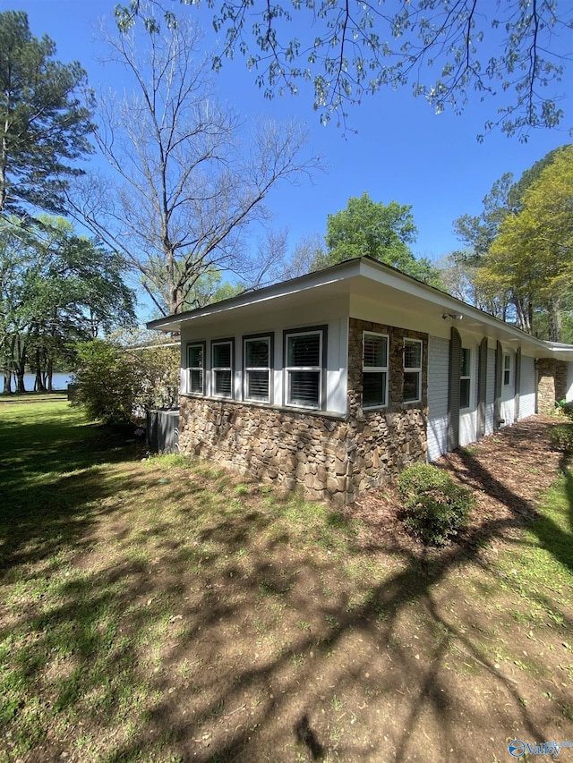 1702 Roseberry Dr, Scottsboro, AL 35769 - view of side of property with a lawn and stone siding