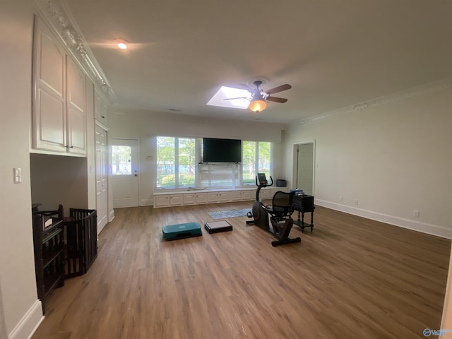 1702 Roseberry Dr, Scottsboro, AL 35769 - exercise area with baseboards, wood finished floors, a ceiling fan, and crown molding