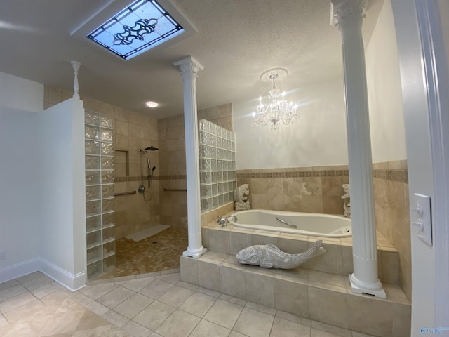 1702 Roseberry Dr, Scottsboro, AL 35769 - full bathroom with walk in shower, a bath, tile patterned flooring, and decorative columns