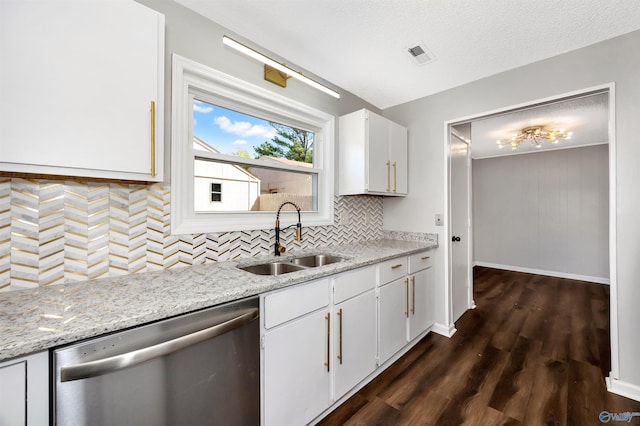 409 Hobbs Rd SE, Huntsville, AL 35803 - kitchen featuring white cabinets, dark wood finished floors, dishwasher, a sink, and tasteful backsplash