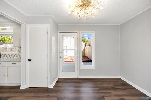 409 Hobbs Rd SE, Huntsville, AL 35803 - entryway with a wealth of natural light, a chandelier, and dark wood-style floors