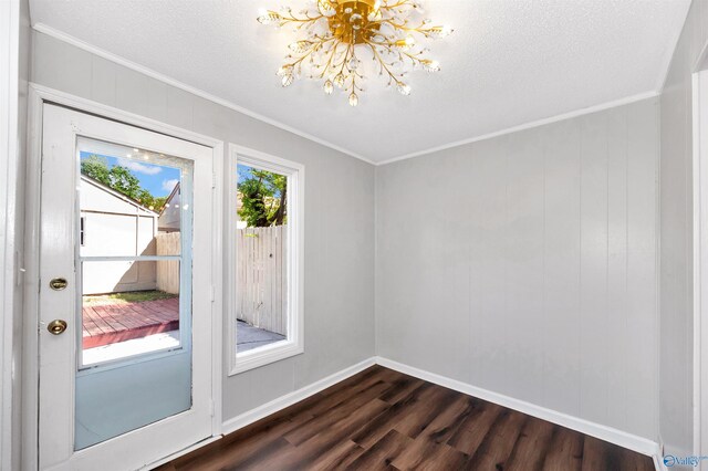 409 Hobbs Rd SE, Huntsville, AL 35803 - interior space with dark wood-type flooring, a chandelier, baseboards, and ornamental molding
