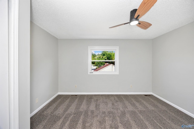 409 Hobbs Rd SE, Huntsville, AL 35803 - spare room featuring baseboards, a ceiling fan, dark colored carpet, and a textured ceiling
