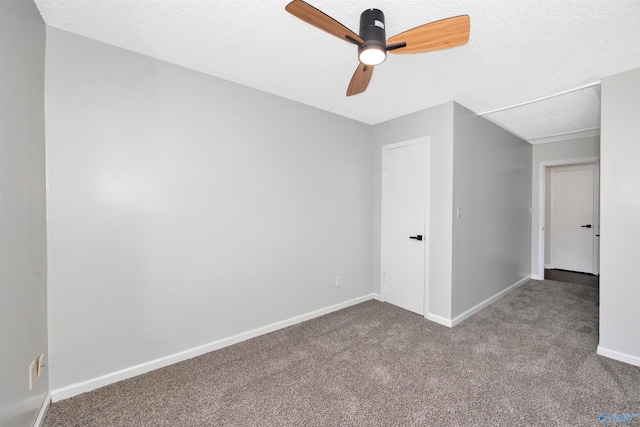 409 Hobbs Rd SE, Huntsville, AL 35803 - carpeted spare room featuring a textured ceiling, baseboards, and ceiling fan