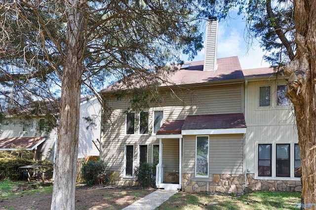 409 Hobbs Rd SE, Huntsville, AL 35803 - view of front of house featuring stone siding and a chimney