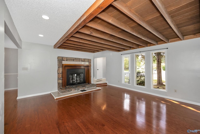 409 Hobbs Rd SE, Huntsville, AL 35803 - unfurnished living room with recessed lighting, a stone fireplace, baseboards, and wood finished floors