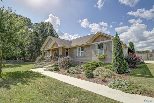 view of front of house with a front lawn and covered porch