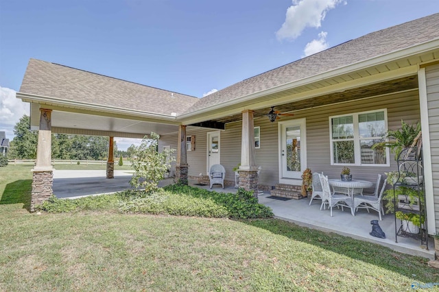 exterior space with a patio, ceiling fan, and a front yard