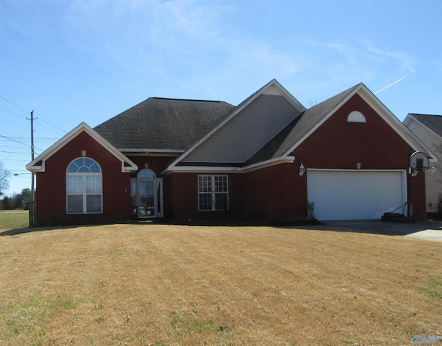 ranch-style house featuring a front lawn and an attached garage