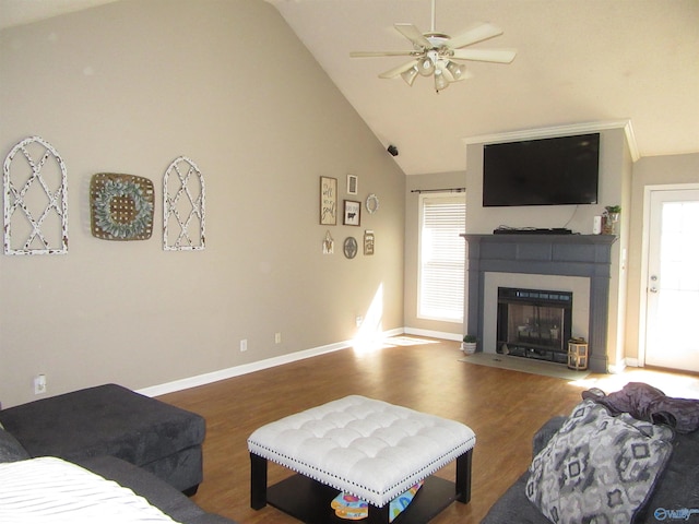 living room featuring a fireplace with flush hearth, high vaulted ceiling, wood finished floors, and baseboards