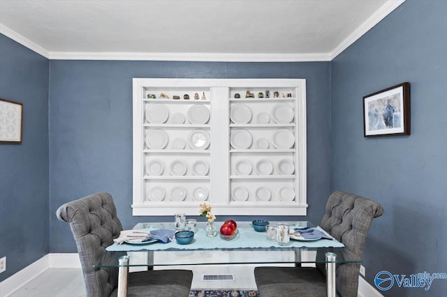 office area featuring ornamental molding, wood finished floors, and baseboards