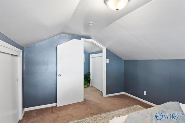 bonus room with carpet, vaulted ceiling, and baseboards