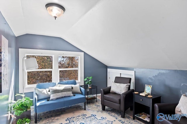 living area featuring vaulted ceiling