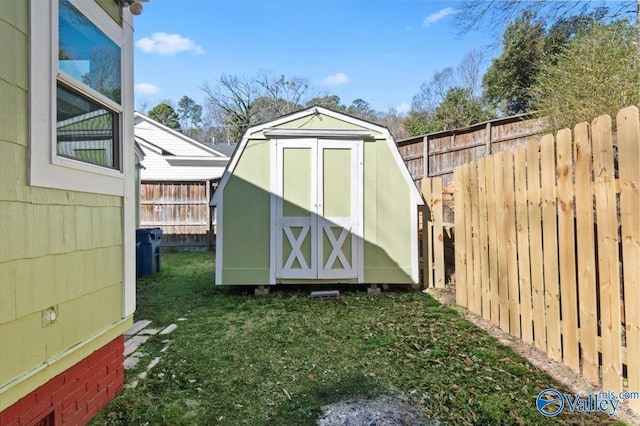 view of shed with a fenced backyard