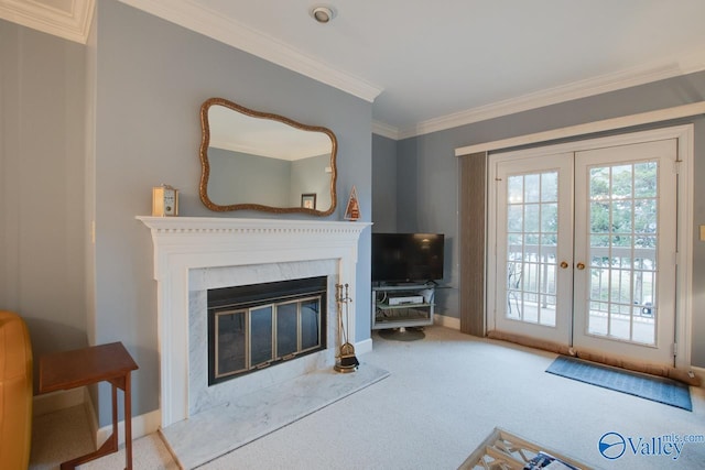 living room with light carpet, a fireplace, crown molding, and french doors