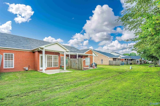 202 Santana Dr, Athens, AL 35611 - rear view of house with a patio area and brick siding