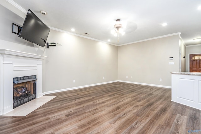 202 Santana Dr, Athens, AL 35611 - unfurnished living room with ornamental molding, wood finished floors, ceiling fan, a tiled fireplace, and recessed lighting