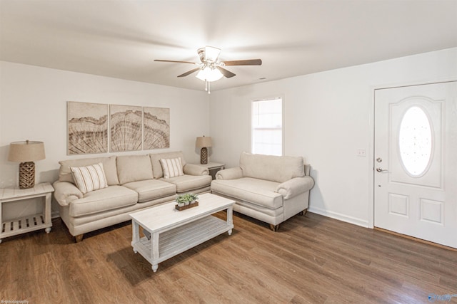 living room featuring a healthy amount of sunlight, hardwood / wood-style flooring, and ceiling fan