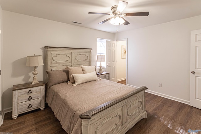 bedroom featuring dark hardwood / wood-style flooring and ceiling fan