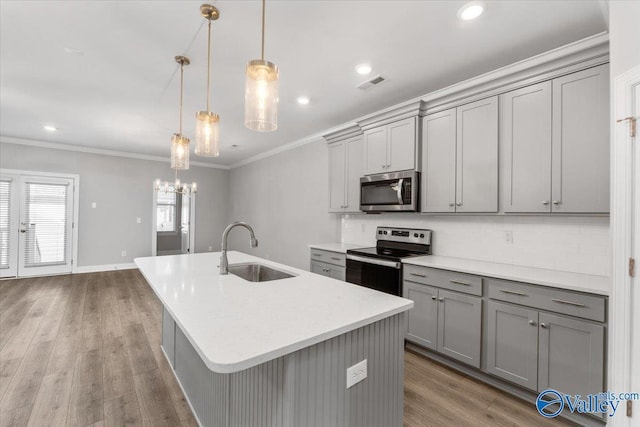 kitchen with gray cabinets, sink, and stainless steel appliances