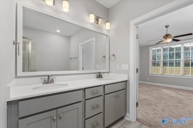 bathroom featuring ceiling fan and vanity