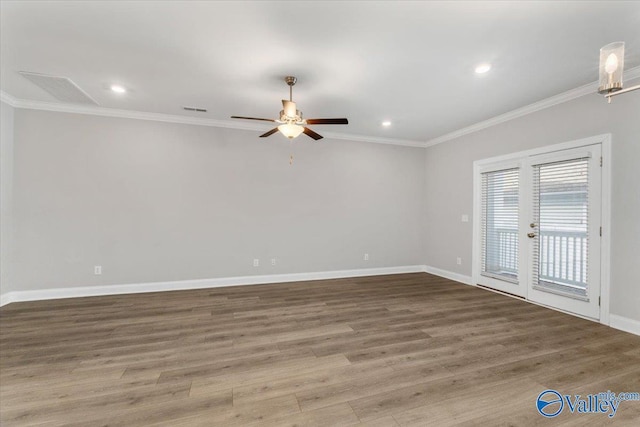 unfurnished room featuring hardwood / wood-style flooring, ceiling fan, ornamental molding, and french doors