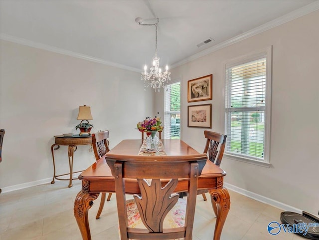 986 Tracey Ln, Decatur, AL 35601 - dining space featuring a chandelier, ornamental molding, baseboards, and light tile patterned floors