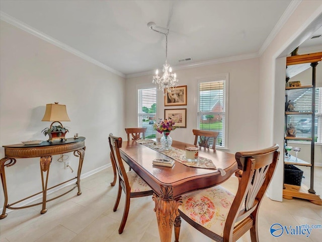 986 Tracey Ln, Decatur, AL 35601 - dining area featuring a chandelier, crown molding, and baseboards