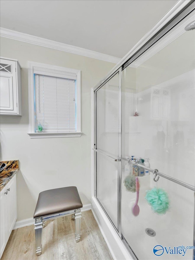 986 Tracey Ln, Decatur, AL 35601 - full bath featuring a stall shower, wood finished floors, crown molding, baseboards, and vanity