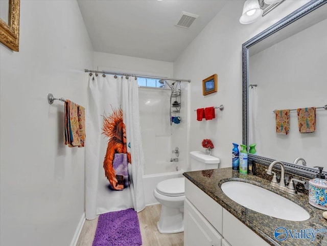986 Tracey Ln, Decatur, AL 35601 - full bathroom with vanity, wood finished floors, shower / bath combination with curtain, and toilet