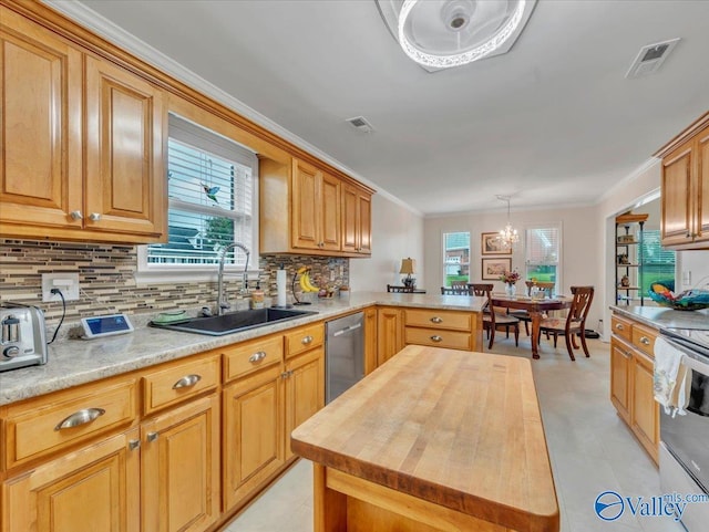 986 Tracey Ln, Decatur, AL 35601 - kitchen featuring a sink, stainless steel appliances, wooden counters, crown molding, and decorative backsplash
