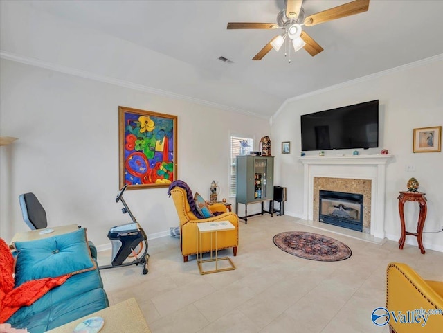 986 Tracey Ln, Decatur, AL 35601 - living room featuring ornamental molding, a ceiling fan, vaulted ceiling, a fireplace, and baseboards