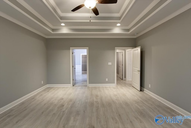 26415 Birkshire Ln, Athens, AL 35613 - unfurnished bedroom with a tray ceiling, light wood-style flooring, ornamental molding, baseboards, and a ceiling fan
