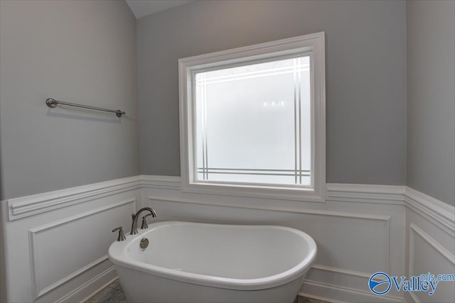 26415 Birkshire Ln, Athens, AL 35613 - full bathroom featuring a freestanding tub, wainscoting, and a decorative wall