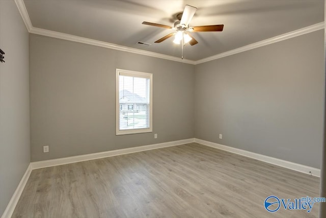 26415 Birkshire Ln, Athens, AL 35613 - empty room with ceiling fan, crown molding, wood finished floors, and baseboards