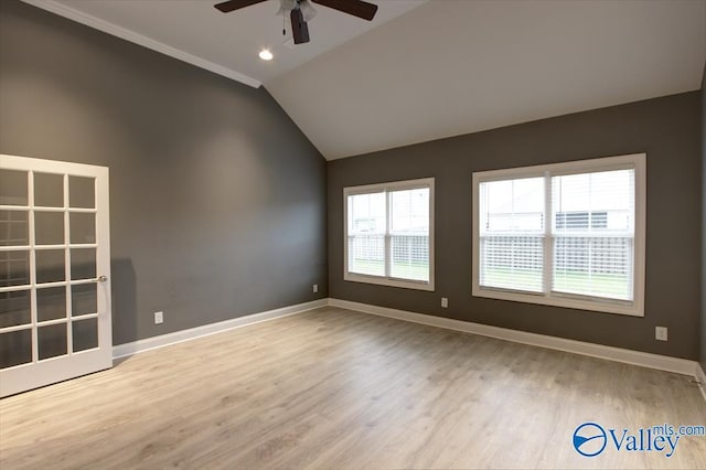 26415 Birkshire Ln, Athens, AL 35613 - empty room with ceiling fan, lofted ceiling, baseboards, and wood finished floors