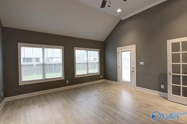 26415 Birkshire Ln, Athens, AL 35613 - unfurnished room with a ceiling fan, vaulted ceiling, light wood-style flooring, and baseboards