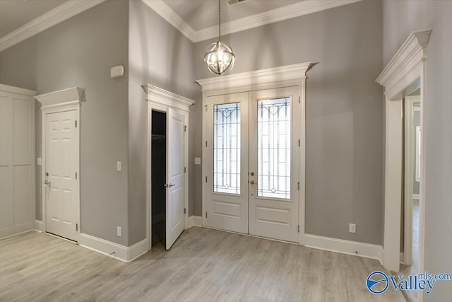 26415 Birkshire Ln, Athens, AL 35613 - entrance foyer with french doors, light wood-style floors, crown molding, baseboards, and a high ceiling