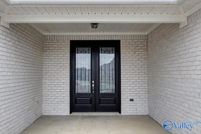 26415 Birkshire Ln, Athens, AL 35613 - property entrance with french doors and brick siding