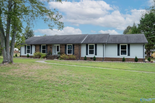 ranch-style home featuring a front yard