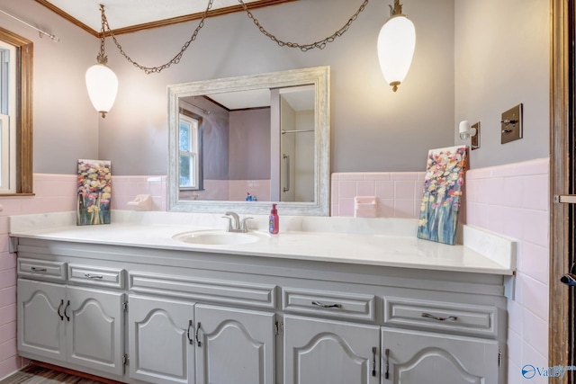 bathroom with vanity and tile walls