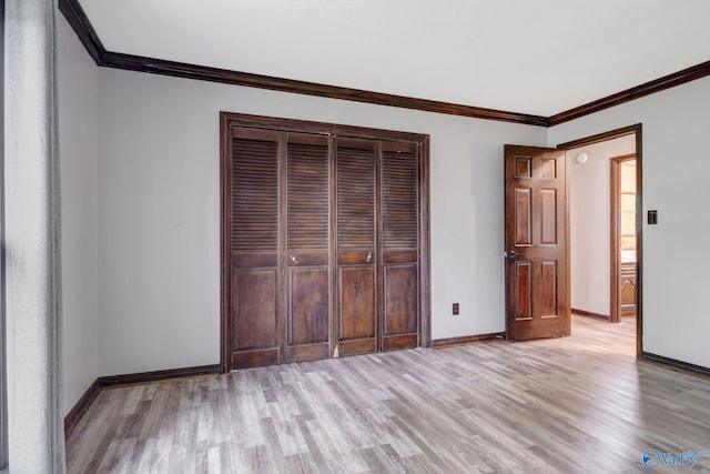 unfurnished bedroom with crown molding and light hardwood / wood-style flooring