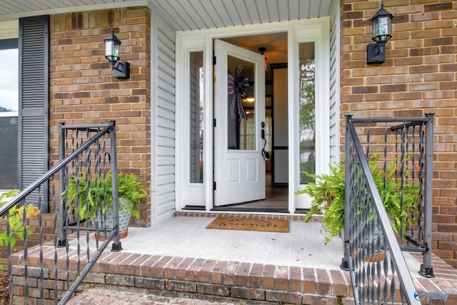 view of exterior entry with covered porch