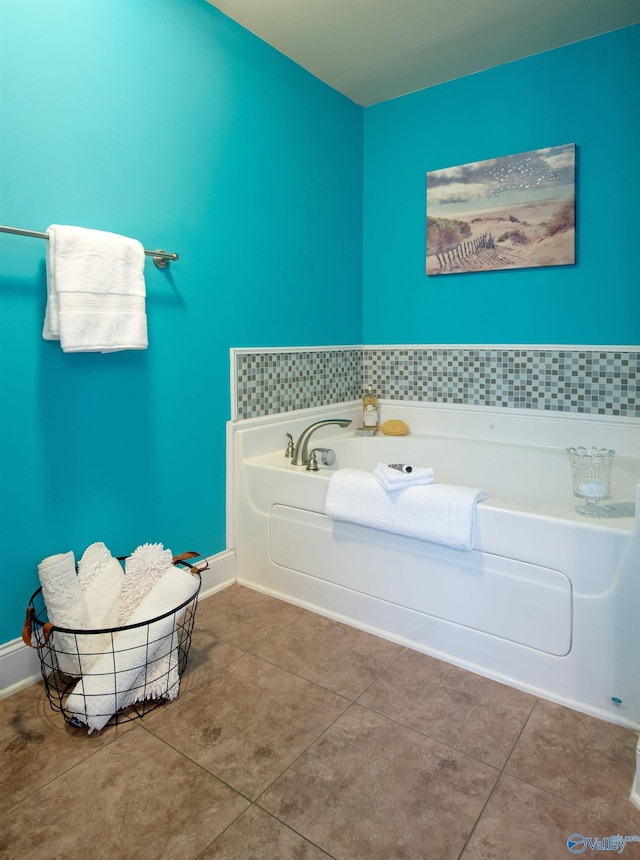 full bath with tile patterned floors and a garden tub