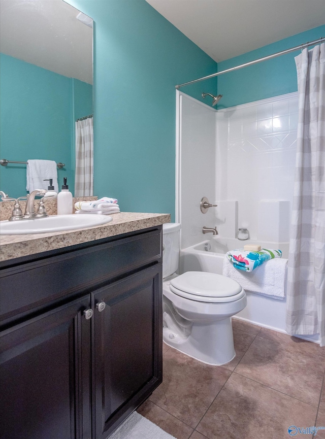 bathroom with vanity, tile patterned flooring, shower / bath combo, and toilet
