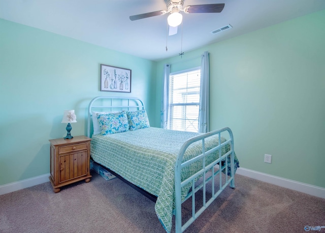 bedroom featuring visible vents, carpet, baseboards, and a ceiling fan